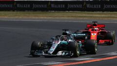 NORTHAMPTON, ENGLAND - JULY 08: Lewis Hamilton of Great Britain driving the (44) Mercedes AMG Petronas F1 Team Mercedes WO9 leads Sebastian Vettel of Germany driving the (5) Scuderia Ferrari SF71H on track during the Formula One Grand Prix of Great Britain at Silverstone on July 8, 2018 in Northampton, England.  (Photo by Charles Coates/Getty Images)