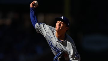 CHICAGO, ILLINOIS - APRIL 06: Yoshinobu Yamamoto #18 of the Los Angeles Dodgers delivers a pitch during the second inning against the Chicago Cubs at Wrigley Field on April 06, 2024 in Chicago, Illinois.   Michael Reaves/Getty Images/AFP (Photo by Michael Reaves / GETTY IMAGES NORTH AMERICA / Getty Images via AFP)