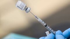 In this file photo a syringe is filled with a first dose of the Pfizer Covid-19 vaccine.