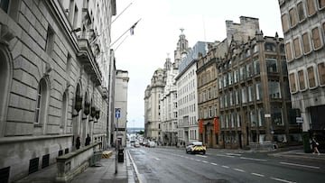 Pedestrians walk down Water Street in Liverpool, north-west England on May 28, 2025, where a car ploughed in to crowds that had gathered on May 26 to watch an open-top bus victory parade for Liverpool's Premier League trophy parade. Police ruled out terrorism following the incident in the city on May 26 as thousands turned out in the rain to see Liverpool's victory parade. Police arrested a 53-year-old white British man who they believe to be the driver. According to the last information he was under the influence of drugs when the car ploughed in to crowds. He is held in custody for "attempted murder". (Photo by Paul ELLIS / AFP)