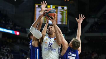 MADRID, SPAIN - DECEMBER 14: Walter Tavares, #22 of Real Madrid shoots the ball against Malte Delow, #6 and Oscar Da Silva, #1 of Alba Berlin during the Turkish Airlines EuroLeague Regular Season Round 15 match between Real Madrid and Alba Berlin at Wizink Center on December 14, 2021 in Madrid, Spain. (Photo by Angel Martinez/Euroleague Basketball via Getty Images)