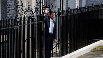 Mr Sunak waves to the press after giving an opening speech on the day of his accession to power.