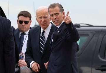 U.S. President Joe Biden stands with his son Hunter Biden, who earlier in the day was found guilty on all three counts in his criminal gun charges trial, as President Biden arrived at the Delaware Air National Guard Base in New Castle, Delaware, U.S., June 11, 2024. REUTERS/Anna Rose Layden