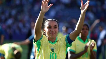 Brazil's forward #10 Marta reacts as she attends the medal ceremony after the women's gold medal final football match between Brazil and US during the Paris 2024 Olympic Games at the Parc des Princes in Paris on August 10, 2024. (Photo by FRANCK FIFE / AFP)