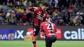 Atlas' forward #58 Arturo Gonzalez (L) celebrates with temamate Argentine defender #21 Rodrigo Schlegel after scoring the opening goal during the Liga MX Clausura football match between America and Atlas at Banorte Stadium in Mexico City on April 25, 2026. (Photo by Victor Cruz / AFP)