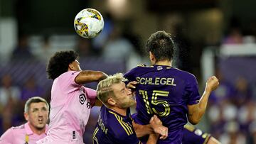 Sep 24, 2023; Orlando, Florida, USA; Orlando City defender Rodrigo Schlegel (15) heads the ball against Inter Miami CF defender DeAndre Yedlin (2) during the first half at Exploria Stadium. Mandatory Credit: Cory Knowlton-USA TODAY Sports