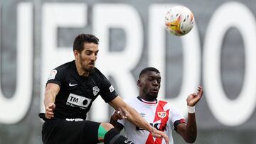 MADRID, SPAIN - OCTOBER 17: Randy Nteka of Rayo Vallecano battles for possession with Pedro Bigas of Elche during the LaLiga Santander match between Rayo Vallecano and Elche CF at Campo de Futbol de Vallecas on October 17, 2021 in Madrid, Spain. (Photo by