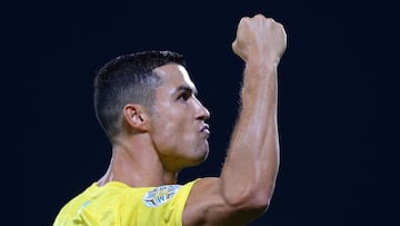 Nassr's Portuguese forward Cristiano Ronaldo celebrates after scoring his team's first goal during the 2023 Arab Club Champions Cup semi-final football match between Saudi Arabia's Al-Nassr and Iraq's Al-Shorta at Prince Sultan bin Abdul Aziz Stadium in Abha on August 9, 2023. (Photo by Abdullah Mahdi / AFP)