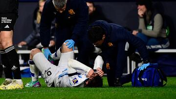 Real Sociedad's Spanish forward #07 Ander Barrenetxea receives medical attention during the Spanish league football match between CA Osasuna and Real Sociedad at El Sadar stadium in Pamplona on December 2, 2023. (Photo by ANDER GILLENEA / AFP)