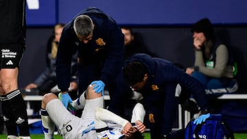 Real Sociedad's Spanish forward #07 Ander Barrenetxea receives medical attention during the Spanish league football match between CA Osasuna and Real Sociedad at El Sadar stadium in Pamplona on December 2, 2023. (Photo by ANDER GILLENEA / AFP)