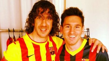 Puyol, junto a Messi.