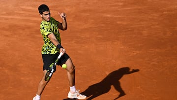 Spain's Carlos Alcaraz returns the ball to Spain's Roberto Bautista during their ATP Barcelona Open "Conde de Godo" tennis tournament singles match at the Real Club de Tenis in Barcelona on April 20, 2023. (Photo by Josep LAGO / AFP)