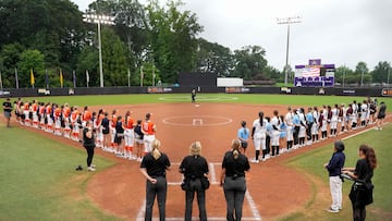 GREENVILLE, NORTH CAROLINA - AUGUST 07: Team Kilfoil and Team McQuillin starters stand for the national anthem with Little League World Series players during an Athletes Unlimited Pro game at Max R. Joyner Family Stadium on August 07, 2024 in Greenville, North Carolina. Grant Halverson/Getty Images/AFP (Photo by GRANT HALVERSON / GETTY IMAGES NORTH AMERICA / Getty Images via AFP)