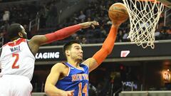 Jan 31, 2017; Washington, DC, USA; New York Knicks center Willy Hernangomez (14) shoots as Washington Wizards guard John Wall (2) defends during the first quarter at Verizon Center. Mandatory Credit: Tommy Gilligan-USA TODAY Sports