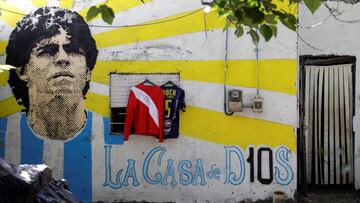 A graffiti of soccer legend Diego Armando Maradona is seen outside the house where he spent his childhood, in Villa Fiorito, outskirts of Buenos Aires, Argentina, November 27, 2020. REUTERS/Ricardo Moraes
