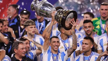 Jul 14, 2024; Miami, FL, USA;  Argentina midfielder Angel Di Maria (11) celebrates after winning the Copa America Final against Colombia at Hard Rock Stadium. Mandatory Credit: Nathan Ray Seebeck-USA TODAY Sports