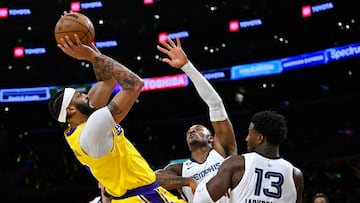 Apr 28, 2023; Los Angeles, California, USA;Los Angeles Lakers forward Anthony Davis (3) is defended by Memphis Grizzlies forward Xavier Tillman (2) and forward Jaren Jackson Jr. (13) as he goes up for a shot in the first quarter of game six of the 2023 NBA playoffs at Crypto.com Arena. Mandatory Credit: Jayne Kamin-Oncea-USA TODAY Sports