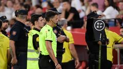 Spanish referee Jesus Gil Manzano checks the VAR during the Spanish Liga football match between Sevilla FC and Girona FC at the Ramon Sanchez Pizjuan stadium in Seville on August 26, 2023. (Photo by CRISTINA QUICLER / AFP)