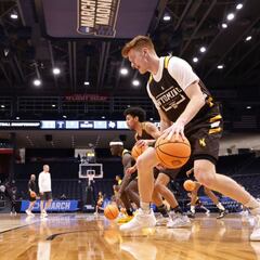 What does a college basketball scholarship include?