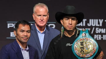 LAS VEGAS, NEVADA - JULY 16: TGB Promotions President Tom Brown (C) looks on as Manny Pacquiao (L) and WBC welterweight champion Mario Barrios (R) pose during their news conference at MGM Grand Hotel & Casino on July 16, 2025 in Las Vegas, Nevada. Barrios is scheduled to defend his title against Pacquiao, who announced he was coming out of retirement nearly four years after his last fight, on July 19 at MGM Grand Garden Arena. Ethan Miller/Getty Images/AFP (Photo by Ethan Miller / GETTY IMAGES NORTH AMERICA / Getty Images via AFP)