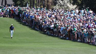 04 April 2022, US, Augusta: American professional golfer Tiger Woods walks down the first fairway after teeing off to begin his Monday's Practice Round for the 2022 Masters at Augusta National Golf Club. Photo: Curtis Compton/The Atlanta Journal-Constitut