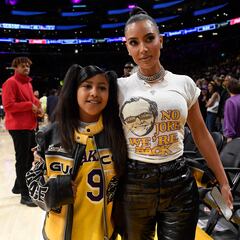 Kim Kardashian and North West cheer on Tristian Thompson at game with homemade signs