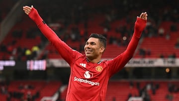 Manchester United's Brazilian midfielder #18 Casemiro waves to fans at the end of the English Premier League football match between Manchester United and Aston Villa at Old Trafford in Manchester, north west England, on March 15, 2026. (Photo by Oli SCARFF / AFP) / RESTRICTED TO EDITORIAL USE. No use with unauthorized audio, video, data, fixture lists, club/league logos or 'live' services. Online in-match use limited to 120 images. An additional 40 images may be used in extra time. No video emulation. Social media in-match use limited to 120 images. An additional 40 images may be used in extra time. No use in betting publications, games or single club/league/player publications. /