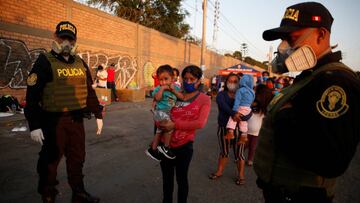 People are seen outside of a Peruvian Air Force base while waiting for flights home to the Peruvian Amazon amid the spread of the coronavirus disease (COVID-19), in Lima, Peru April 24, 2020. REUTERS/Sebastian Castaneda NO RESALES. NO ARCHIVES