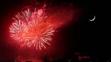 Fireworks light up the sky above the Abdali Boulevard, next to the crescent moon, during a celebration of the country&#039;s 74th Independence Day within a limited number of activities amid the spread of the coronavirus disease (COVID-19), in Amman, Jorda