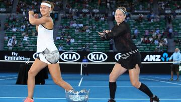 MELBOURNE, AUSTRALIA - JANUARY 27:  Bethanie Mattek-Sands of the United States and Lucie Safarova of the Czech Republic dance behind the trophy after winning their Women&#039;s Doubles Final match against Andrea Hlavackova of the Czech Republic and Shuai Peng of China on day 12 of the 2017 Australian Open at Melbourne Park on January 27, 2017 in Melbourne, Australia.  (Photo by Clive Brunskill/Getty Images)