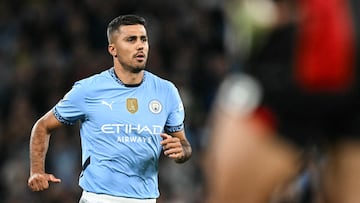 Manchester City's Spanish midfielder #16 Rodri enters the pitch during the English Premier League football match between Manchester City and Bournemouth at the Etihad Stadium in Manchester, north west England, on May 20, 2025. (Photo by Paul ELLIS / AFP) / RESTRICTED TO EDITORIAL USE. No use with unauthorized audio, video, data, fixture lists, club/league logos or 'live' services. Online in-match use limited to 120 images. An additional 40 images may be used in extra time. No video emulation. Social media in-match use limited to 120 images. An additional 40 images may be used in extra time. No use in betting publications, games or single club/league/player publications. /