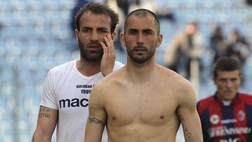 UDINE, ITALY - APRIL 18: Marco Di Vaio and Daniele Portanova of Bologna discusse with the fans at the end the Serie A match between Udinese Calcio and Bologna FC at Stadio Friuli on April 18, 2010 in Udine, Italy. (Photo by Dino Panato/Getty Images) Players of xxx applaud the fans at the end (Photo by Dino Panato/Getty Images)