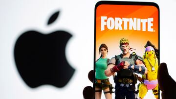 FILE PHOTO: Fortnite game graphic is displayed on a smartphone in front of Apple logo in this illustration created on May 2, 2021. REUTERS/Dado Ruvic/Illustration/File Photo