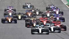 Mercedes&#039; Finnish driver Valtteri Bottas (C) leads his teammate Mercedes&#039; British driver Lewis Hamilton into the first corner during the British Formula One Grand Prix at the Silverstone motor racing circuit in Silverstone, central England, on July 14, 2019. (Photo by Andrej ISAKOVIC / AFP)