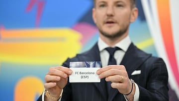 UEFA Foundation for Children ambassador and former Sevilla midfielder, Ivan Rakitic holds up the slip of FC Barcelona (ESP) during the 2025-2026 UEFA Champions League round of 16, quarter-final and semi-final draw at the House of European Football in Nyon, western Switzerland on February 27, 2026. (Photo by Harold CUNNINGHAM / AFP)