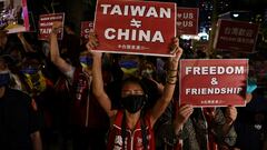 Demonstrators hold signs during a gathering in support of U.S. House of Representatives Speaker Nancy Pelosi's expected visit, in Taipei, Taiwan August 2, 2022. REUTERS/Ann Wang