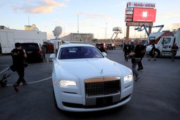 Conor McGregor arrives in a white Rolls Royce.