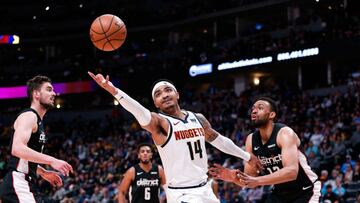 Mar 31, 2019; Denver, CO, USA; Denver Nuggets guard Gary Harris (14) grabs for a loose ball against Washington Wizards forward Jabari Parker (12) in the second quarter at the Pepsi Center. Mandatory Credit: Isaiah J. Downing-USA TODAY Sports