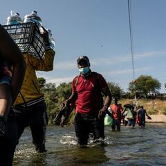 How will Biden respond to the wave of migrants gathered under a Texas bridge?
