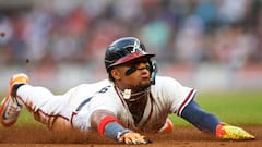 Apr 25, 2023; Atlanta, Georgia, USA; Atlanta Braves right fielder Ronald Acuna Jr. (13) slides into third with a stolen base against the Miami Marlins in first inning at Truist Park. Mandatory Credit: Brett Davis-USA TODAY Sports