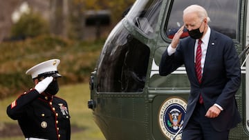 U.S. President Joe Biden salutes a United Staes Marine while descending from Marine One to the White House in Washington, U.S., January 29, 2021. REUTERS/Tom Brenner