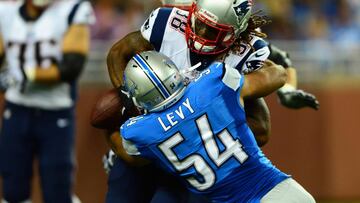 Aug 22, 2013; Detroit, MI, USA; Detroit Lions outside linebacker DeAndre Levy (54) forces New England Patriots running back Brandon Bolden (38) to fumble the ball in the first quarter of a preseason game at Ford Field. Mandatory Credit: Andrew Weber-USA TODAY Sports