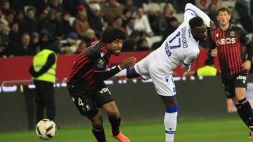 Nice's Brazilian defender Dante (L) fights for the ball with Auxerre's Malian forward Lassine Sinayoko (R) during the French L1 football match between OGC Nice and AJ Auxerre at the Allianz Riviera Stadium in Nice, south-eastern France, on March 3, 2023. (Photo by Valery HACHE / AFP) (Photo by VALERY HACHE/AFP via Getty Images)