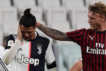 AC Milan's Danish defender Simon Kjaer comforts Juventus' Portuguese forward Cristiano Ronaldo after they collided.