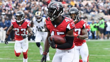 Dec 11, 2016; Los Angeles, CA, USA; Atlanta Falcons middle linebacker Deion Jones (45) returns an interception 33 yards for a touchdown in the second half against the Los Angeles Rams at the Los Angeles Memorial Coliseum. Mandatory Credit: Robert Hanashiro-USA TODAY Sports