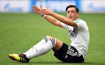 In this file photo taken on June 17, 2018 Germany's midfielder Mesut Ozil gestures as he sits on the field during the Russia 2018 World Cup Group F football match between Germany and Mexico at the Luzhniki Stadium in Moscow.