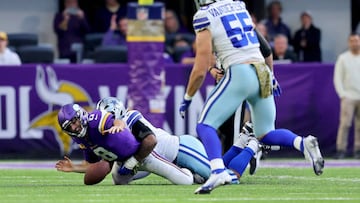 MINNEAPOLIS, MINNESOTA - NOVEMBER 20: Micah Parsons #11 of the Dallas Cowboys strip sacks Kirk Cousins #8 of the Minnesota Vikings \d1 at U.S. Bank Stadium on November 20, 2022 in Minneapolis, Minnesota. (Photo by Adam Bettcher/Getty Images)