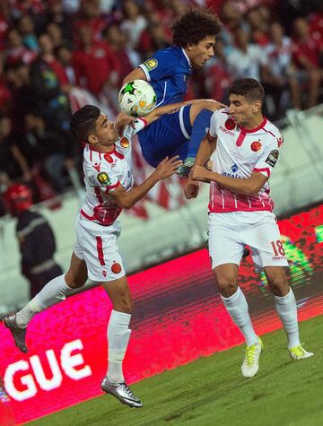 Al-Ahly's Sherif Ekramy (top) vies for the ball during the CAF Champions League final football match between Egypt's Al-Ahly and Morocco's Wydad Casablanca on November 4, 2017, at Mohamed V Stadium in Casablanca.  / 