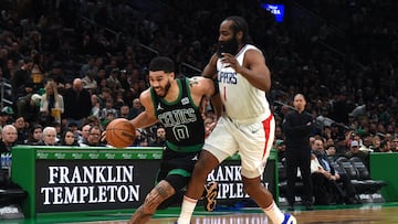 Boston Celtics forward Jayson Tatum (0) controls the ball while LA Clippers guard James Harden (1) defends during the second half at TD Garden.