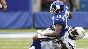 Oct 8, 2017; East Rutherford, NJ, USA; New York Giants wide receiver Odell Beckham (13) is injured after tackle by Los Angeles Chargers cornerback Casey Hayward (26) during second half at MetLife Stadium. Mandatory Credit: Noah K. Murray-USA TODAY Sports